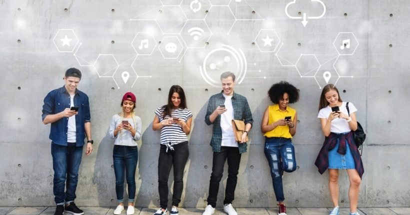 diverse-people-using-their-phones_53876-95102