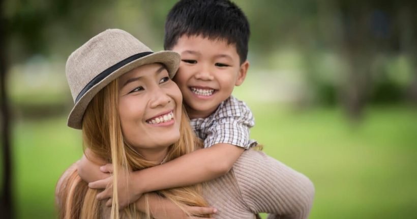 happy-young-mother-son-laughing-little-boy-getting-piggyback-ride-her-back_1150-4766